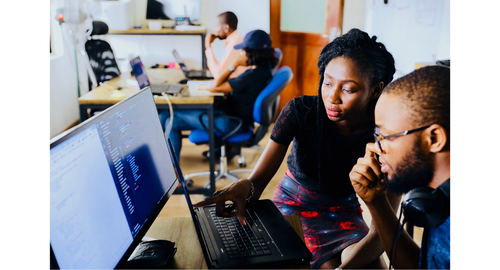 Students looking at computer