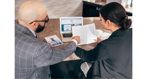 Student going over work with adult