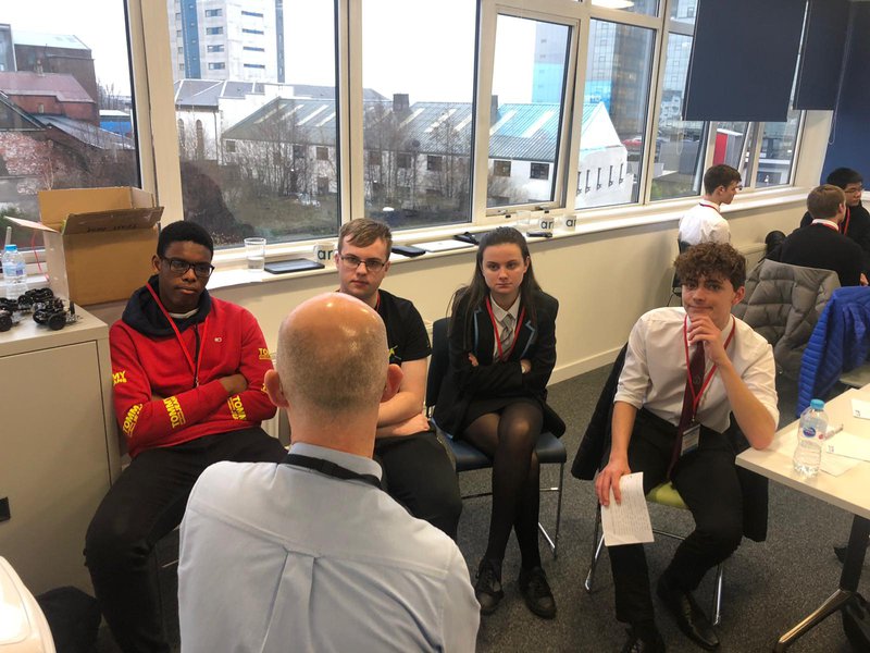 Student&#x27;s listening to a volunteer at an Uptree event