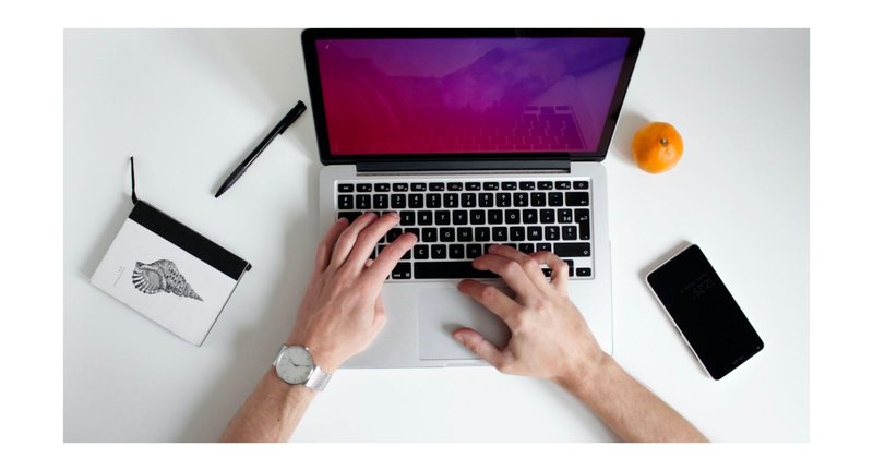 Person typing on a laptop